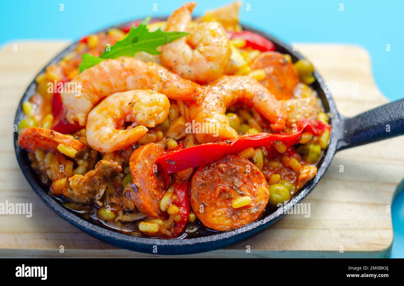 Delicious paella, cooked risotto rice with chicken thigh, king prawns