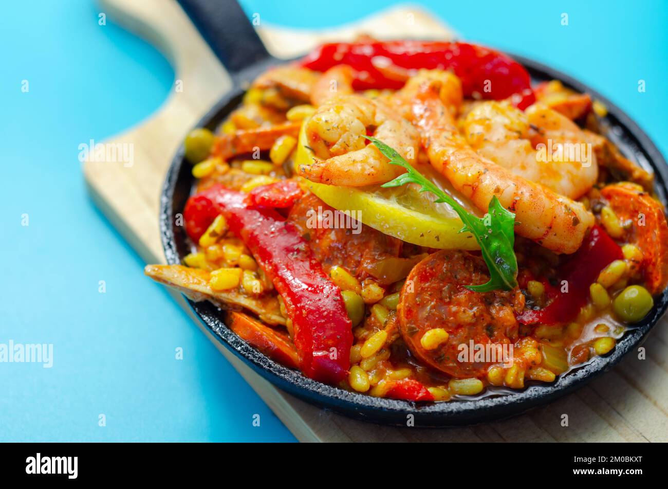 Delicious paella, cooked risotto rice with chicken thigh, king prawns
