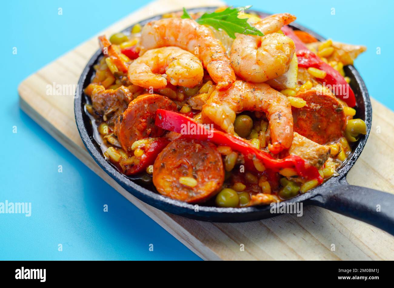 Delicious paella, cooked risotto rice with chicken thigh, king prawns