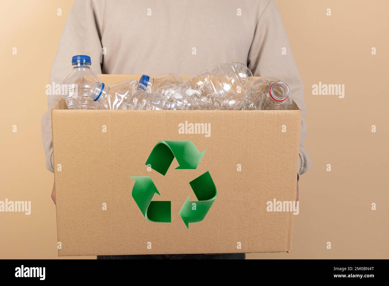 recycling, waste sorting and sustainability concept. Unrecognizable man