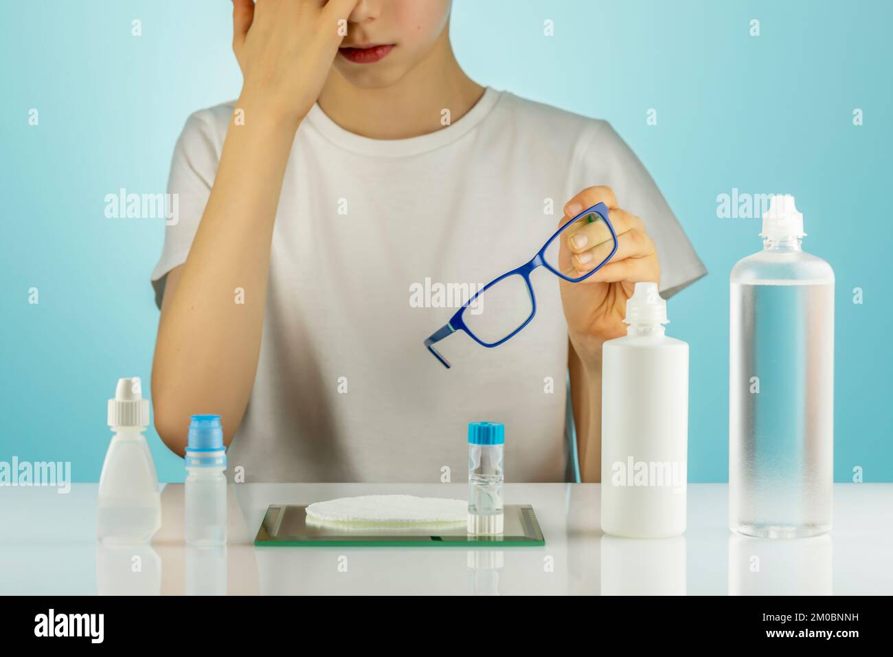 Advertising Night contact Lenses. The boy takes off his glasses and