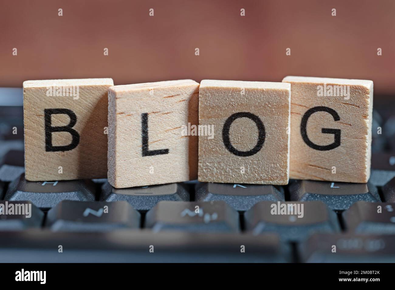 Blog, wooden letters on a keyboard Stock Photo - Alamy
