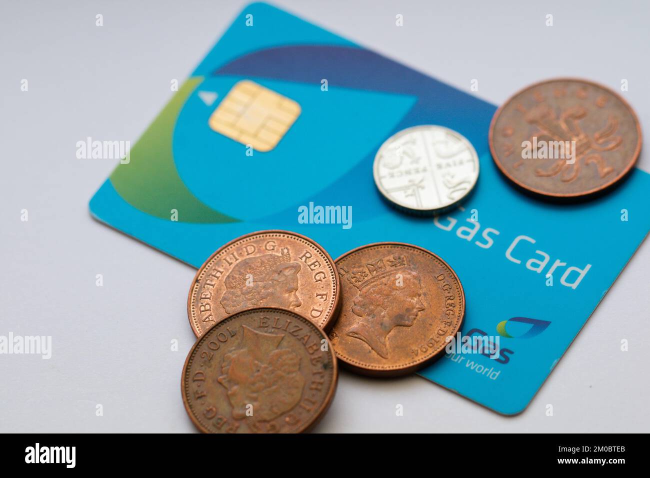 Energy Crisis / Rising Prices / Fuel Poverty - Close-up of a Gas Pre-payment card and British Coins Stock Photo