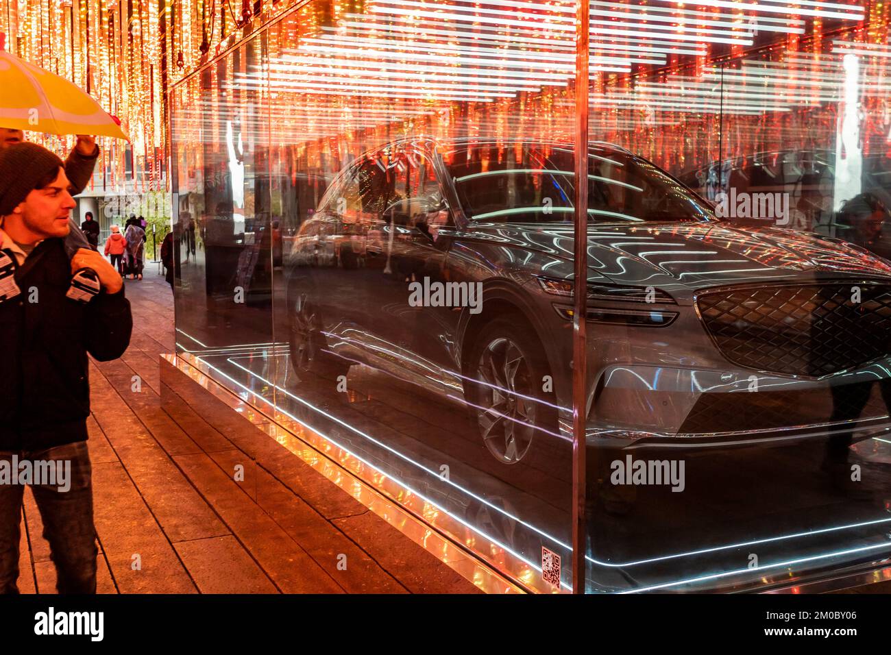 A 2023 Genesis Electrified GV70 electric vehicle displayed in its own vitrine on the High Line Park in New York on Saturday, December 3, 2022. The luxury vehicle maker Genesis Motors LLC is a division of the Hyundai Motor Group. (© Richard B. Levine) Stock Photo