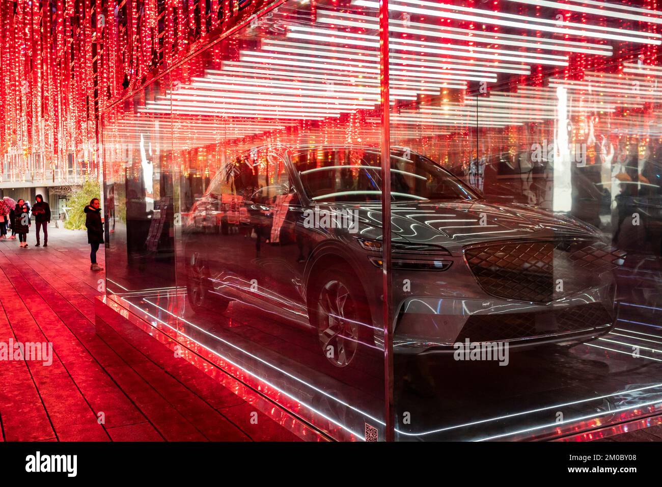 A 2023 Genesis Electrified GV70 electric vehicle displayed in its own vitrine on the High Line Park in New York on Saturday, December 3, 2022. The luxury vehicle maker Genesis Motors LLC is a division of the Hyundai Motor Group. (© Richard B. Levine) Stock Photo
