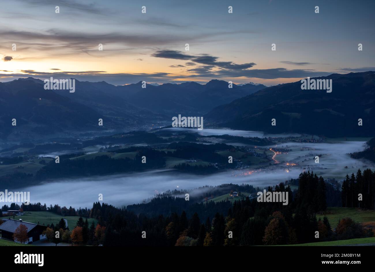View from lake Astbergsee into Lenkental valley towards Kitzbuehel, Tyrol, Austria in early morning Stock Photo