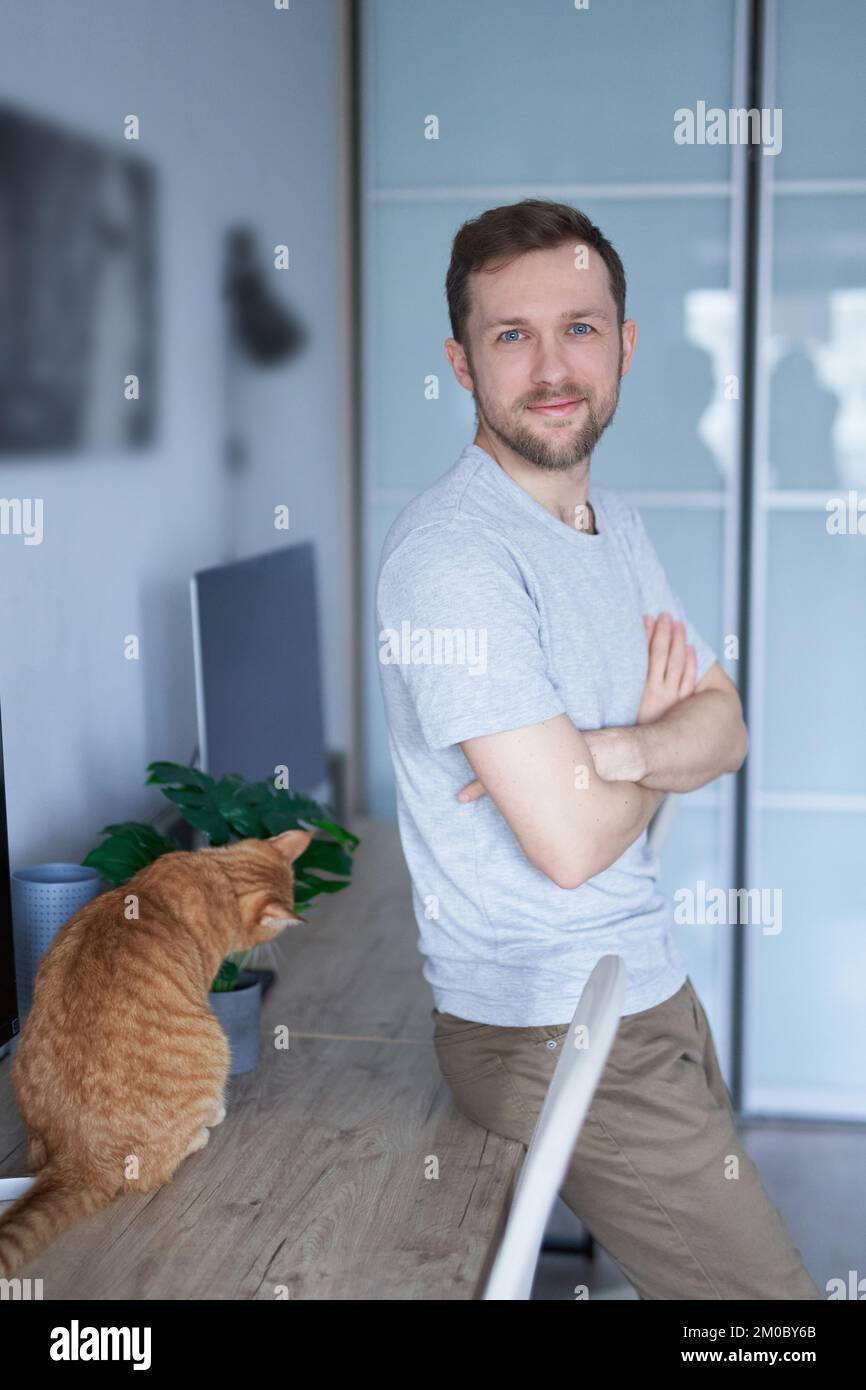 Portrait of cheerful bearded caucasian male freelance software ...