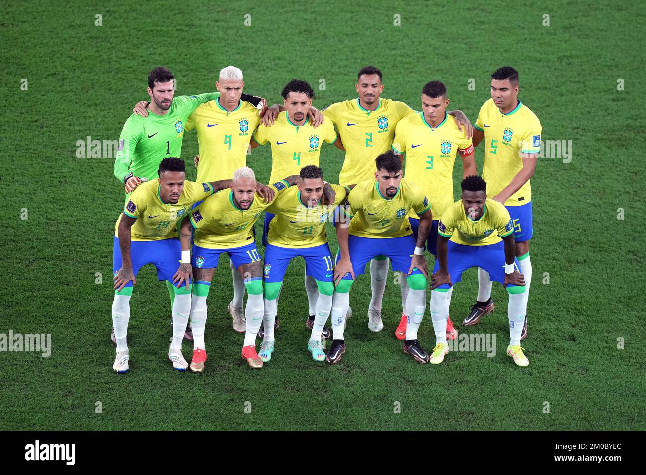 (left to right, back to front) Brazil goalkeeper Alisson, Richarlison, Marquinhos, Danilo, Thiago Silva, Casemiro, Eder Militao, Neymar, Raphinha, Lucas Paqueta, and Vinicius Junior line up before the FIFA World Cup Round of Sixteen match at Stadium 974 in Doha, Qatar. Picture date: Monday December 5, 2022. Stock Photo