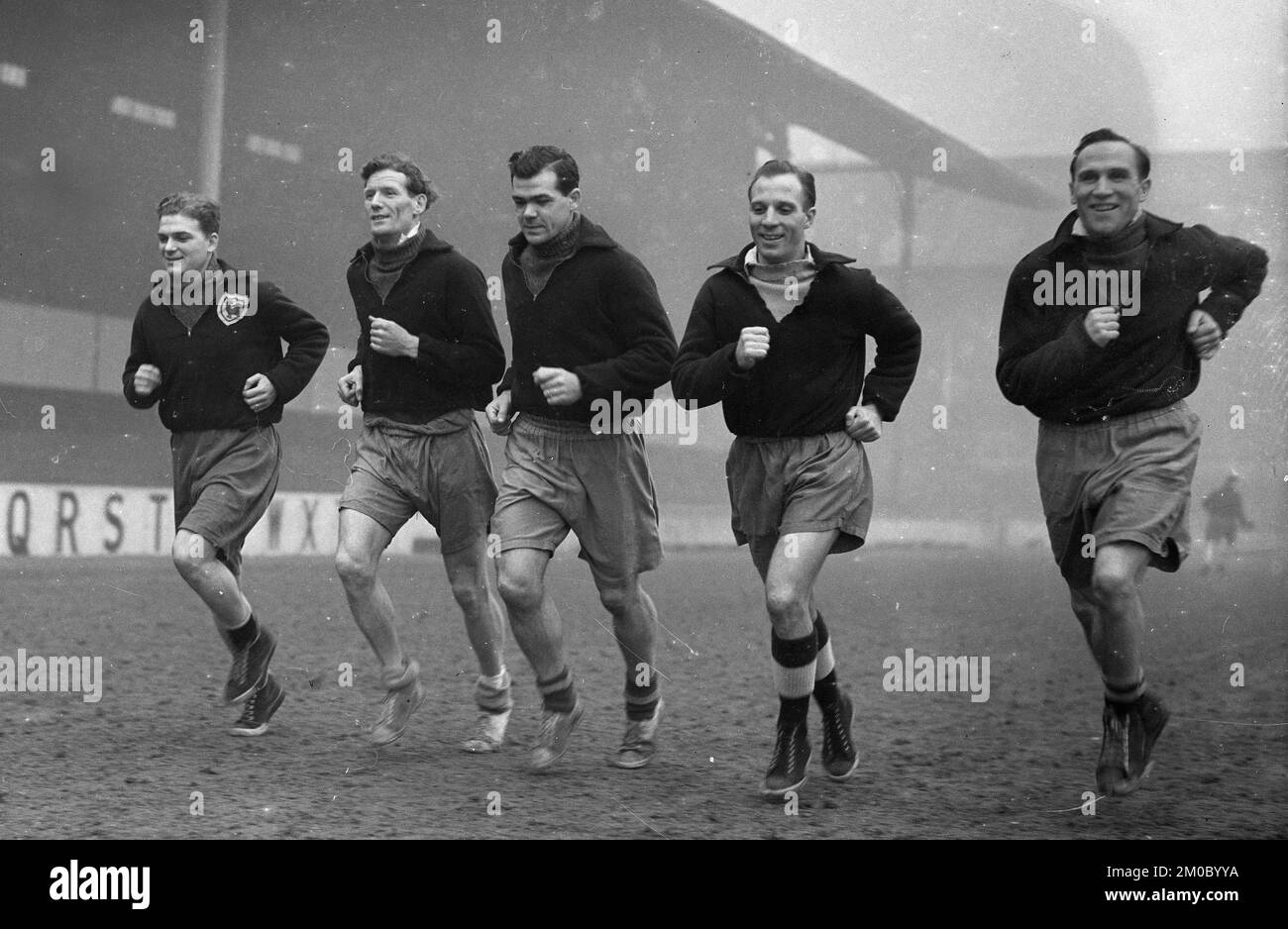 Tottenham Hotspur footballers LtoR Billy Walters, Les Bennett, Len Duquemin, Eddie Baily, Les Medley training on White Hart Lane pitch 1951 Stock Photo