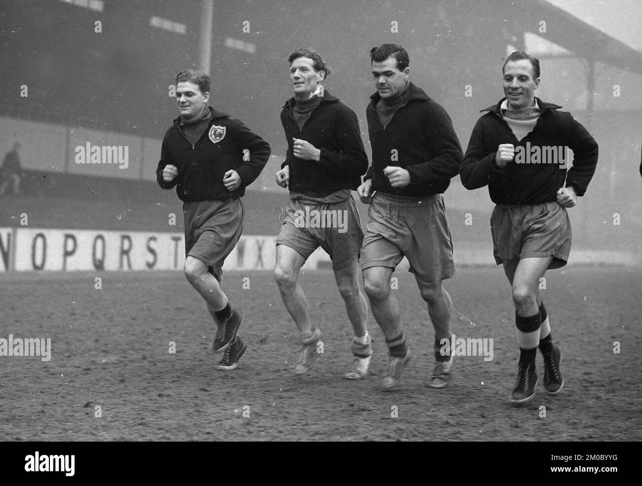 Tottenham Hotspur footballers LtoR Billy Walters, Les Bennett, Len Duquemin, Eddie Baily, Les Medley training on White Hart Lane pitch 1951 Stock Photo
