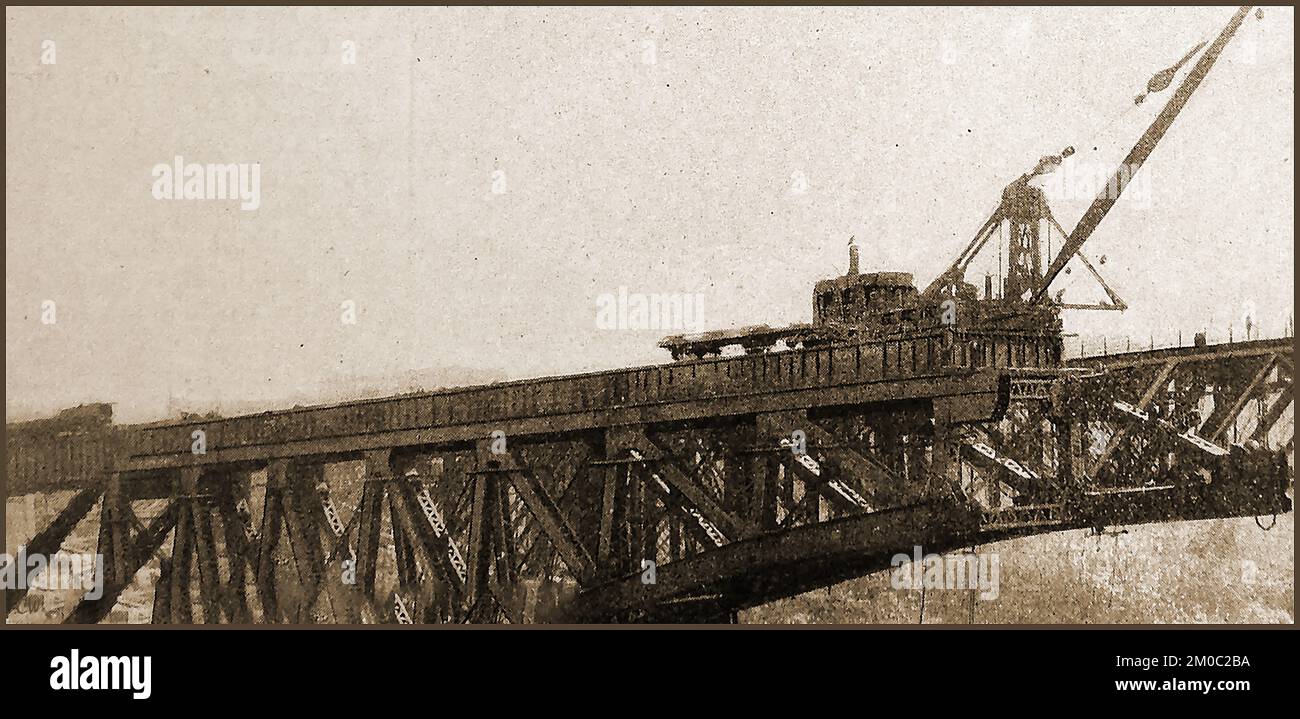 An early photograph showing the building of the Niagara Gorge railway bridge for the Michigan Central railroad. Also known as  the  Michigan Central Railway Bridge, it is now out of service but still (2022)spans  the Niagara Gorge between Niagara Falls, Ontario and Niagara Falls, New York. Owned by the  Canadian Pacific Railway, having been purchased by them in 1990 Stock Photo