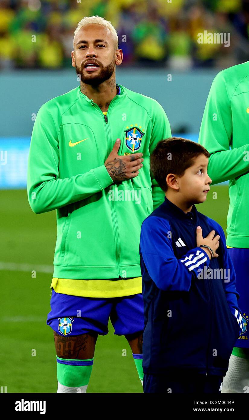 Doha, Qatar, 5th December 2022.  Neymar Jr of Brazil and a mascot during the anthems during the FIFA World Cup 2022 match at Stadium 974, Doha. Picture credit should read: David Klein / Sportimage Stock Photo