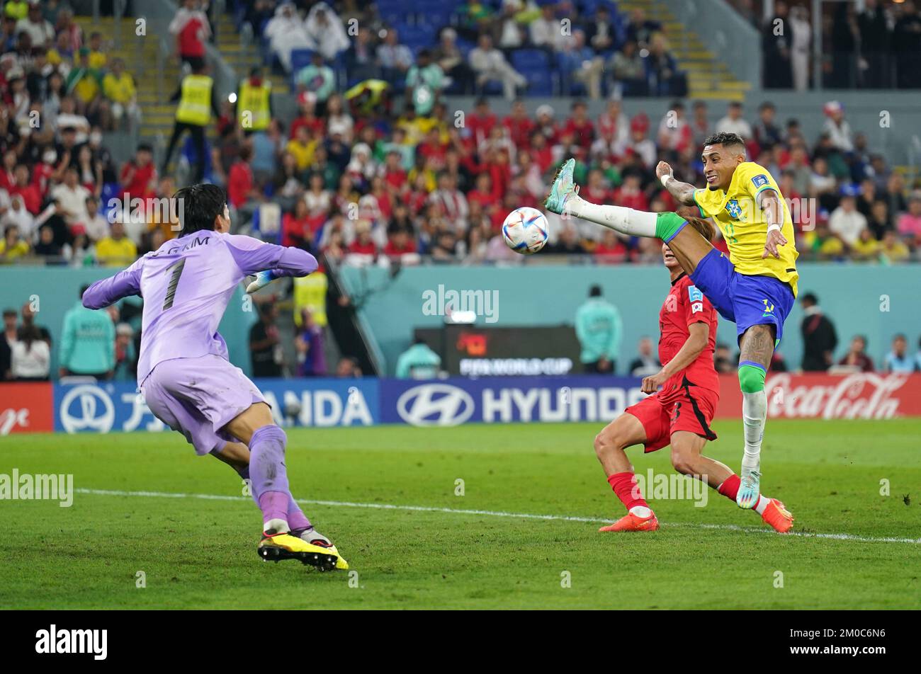 Brazil's Raphinha (right) attempts a shot on goal during the FIFA World ...