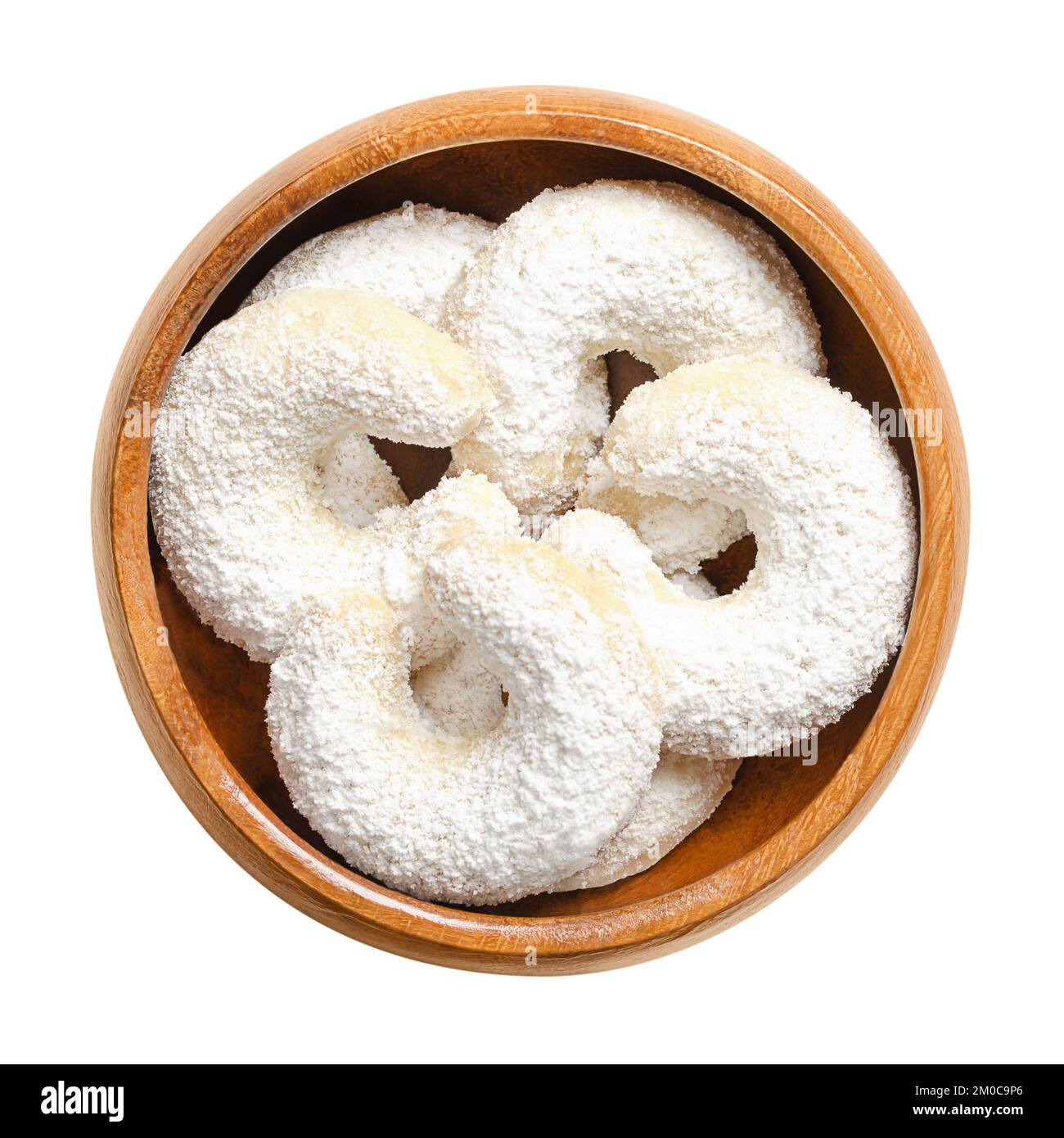 Vanilla crescents, Vanillekipferl in a wooden bowl. Crescent shaped Christmas biscuits, originally from Austria. Stock Photo