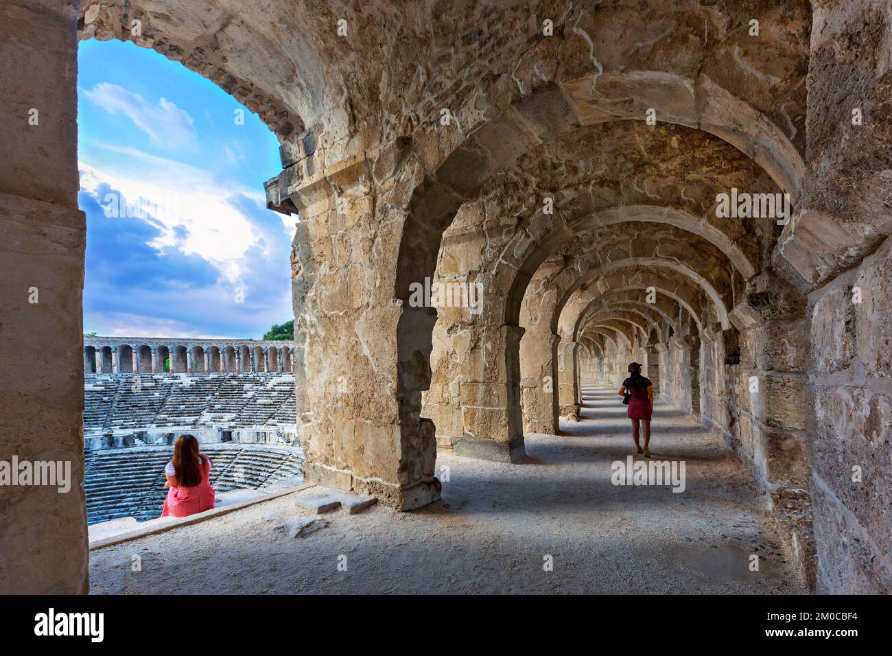 Visitors in the Roman Amphitheater of Aspendos in Antalya, Turkey Stock Photo