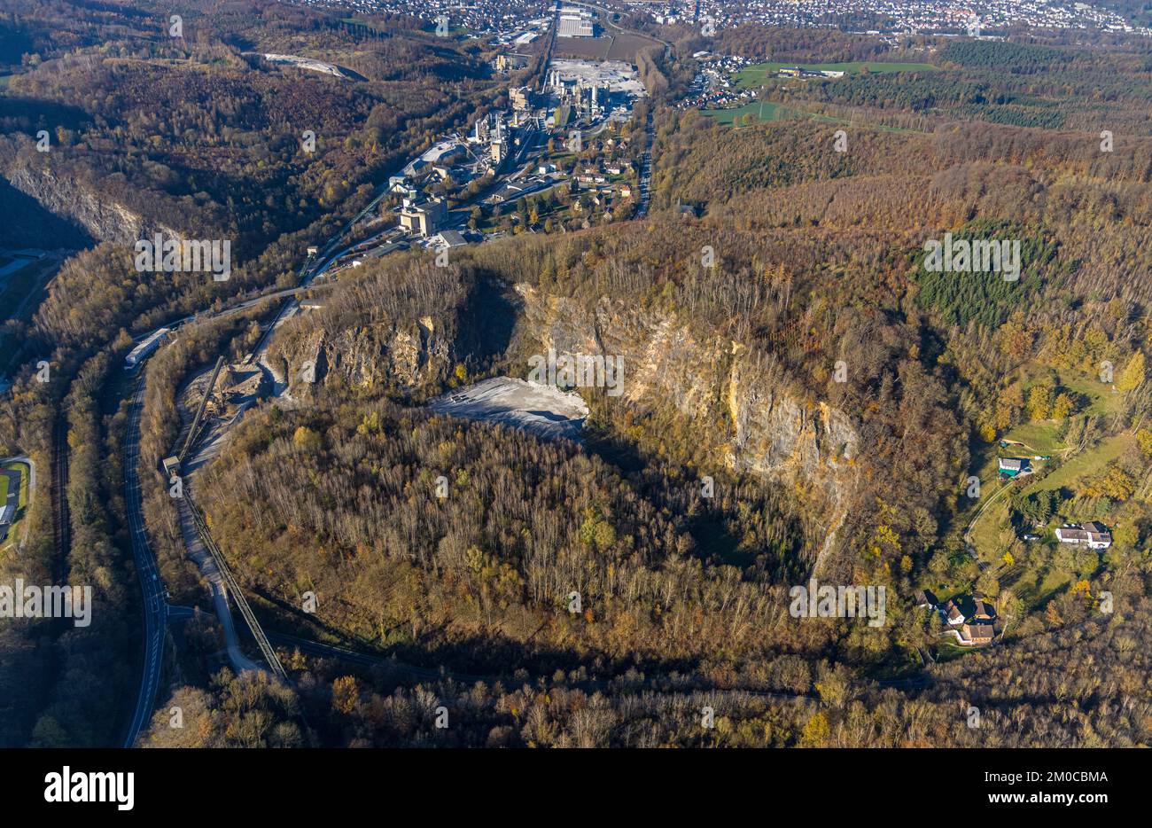 Aerial view, quarry at the Hönnetalstraße with industrial area and Rheinkalk GmbH in the district Oberrödinghausen in Menden, Sauerland, North Rhine-W Stock Photo