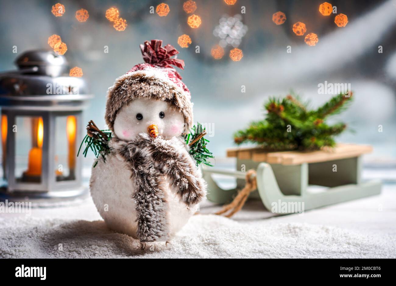 Toy snowman with festive illuminated Christmas holiday abstract background Stock Photo