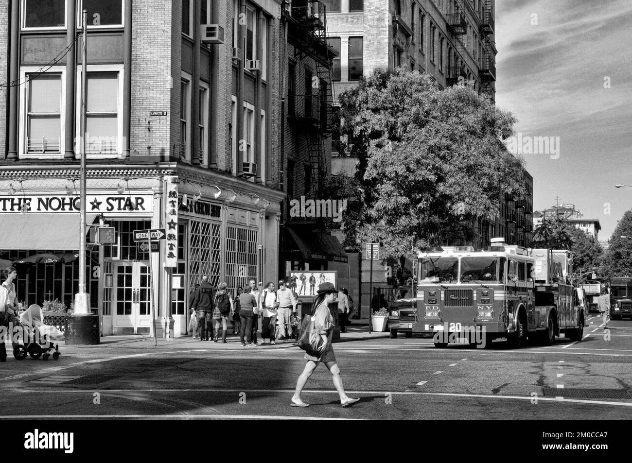 A fire truck passes in front of The Noho Star, one of the restaurants in the East Village. Manhattan, New York, USA Stock Photo
