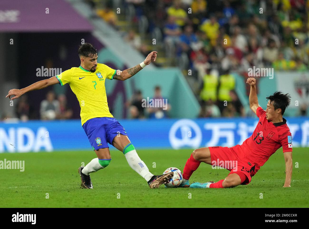 South Korea's Son Jun-ho (right) challenges Brazil's Lucas Paqueta ...