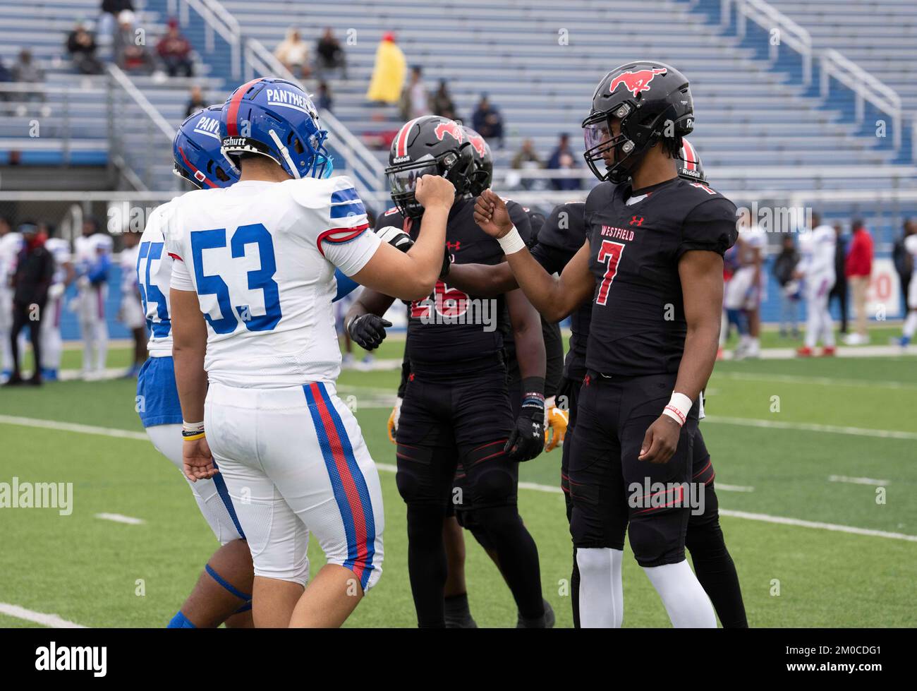 Georgetown Texas USA, December 3 2022: Team captains from opposing teams bump fists after coin flip before start of a University Scholastic League (UIL) quarter-final playoff football game in central Texas. ©Bob Daemmrich Stock Photo