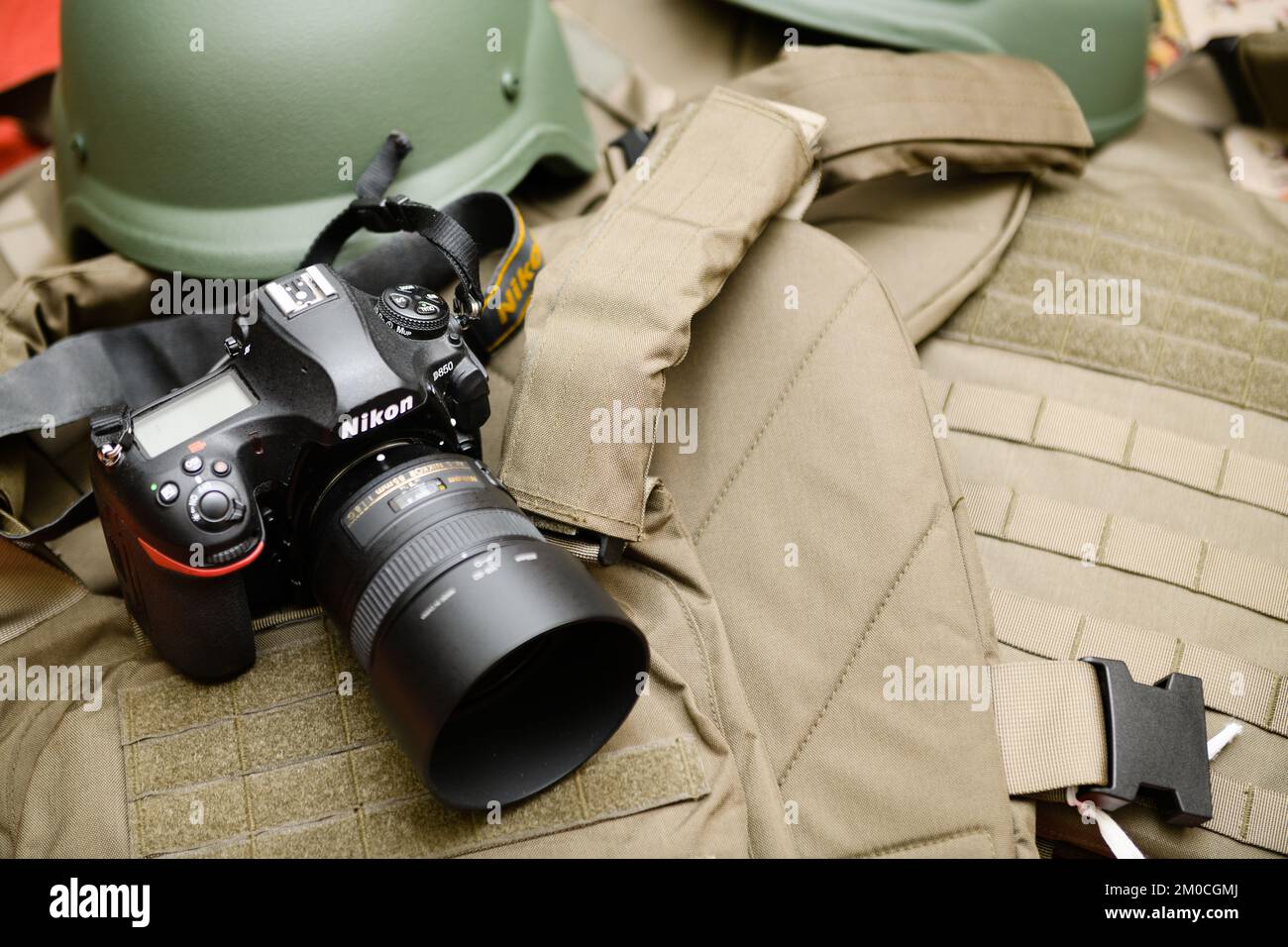 Dnipro, Ukraine Nov 17, 2022: top view of the camera and body armor. Photojournalist at war. Concept. Stock Photo