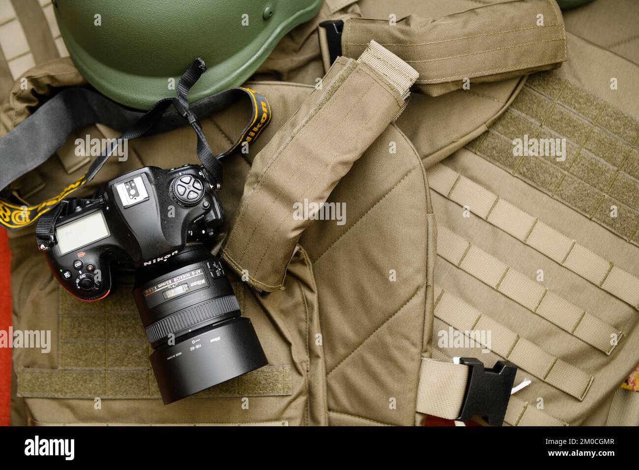 Dnipro, Ukraine Nov 17, 2022: top view of the camera and body armor. Photojournalist at war. Concept. Stock Photo