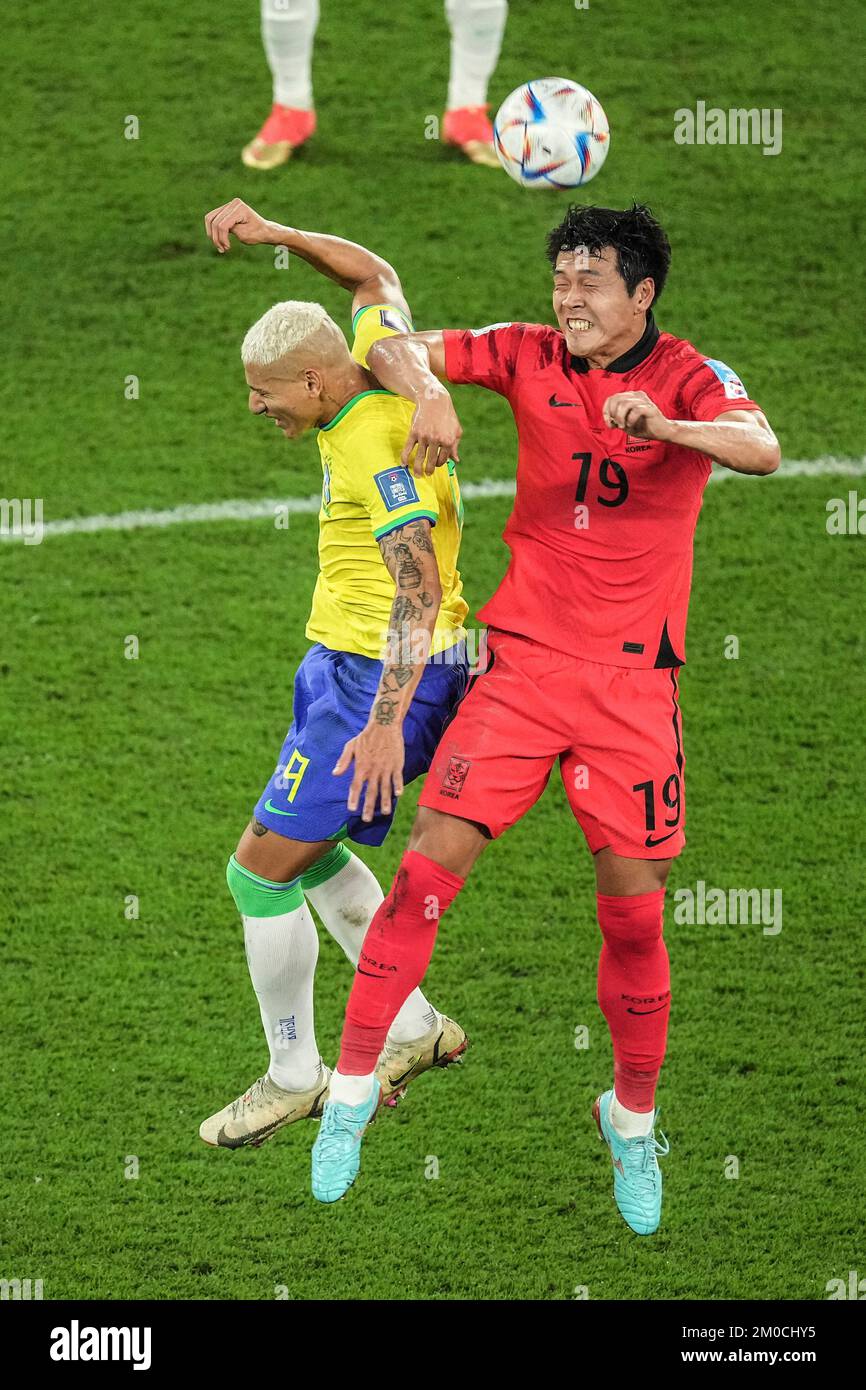 Doha, Qatar. 5th Dec, 2022. Kim Young-gwon (R) of South Korea vies with Richarlison of Brazil during their Round of 16 match at the 2022 FIFA World Cup at Stadium 974 in Doha, Qatar, Dec. 5, 2022. Credit: Pan Yulong/Xinhua/Alamy Live News Stock Photo