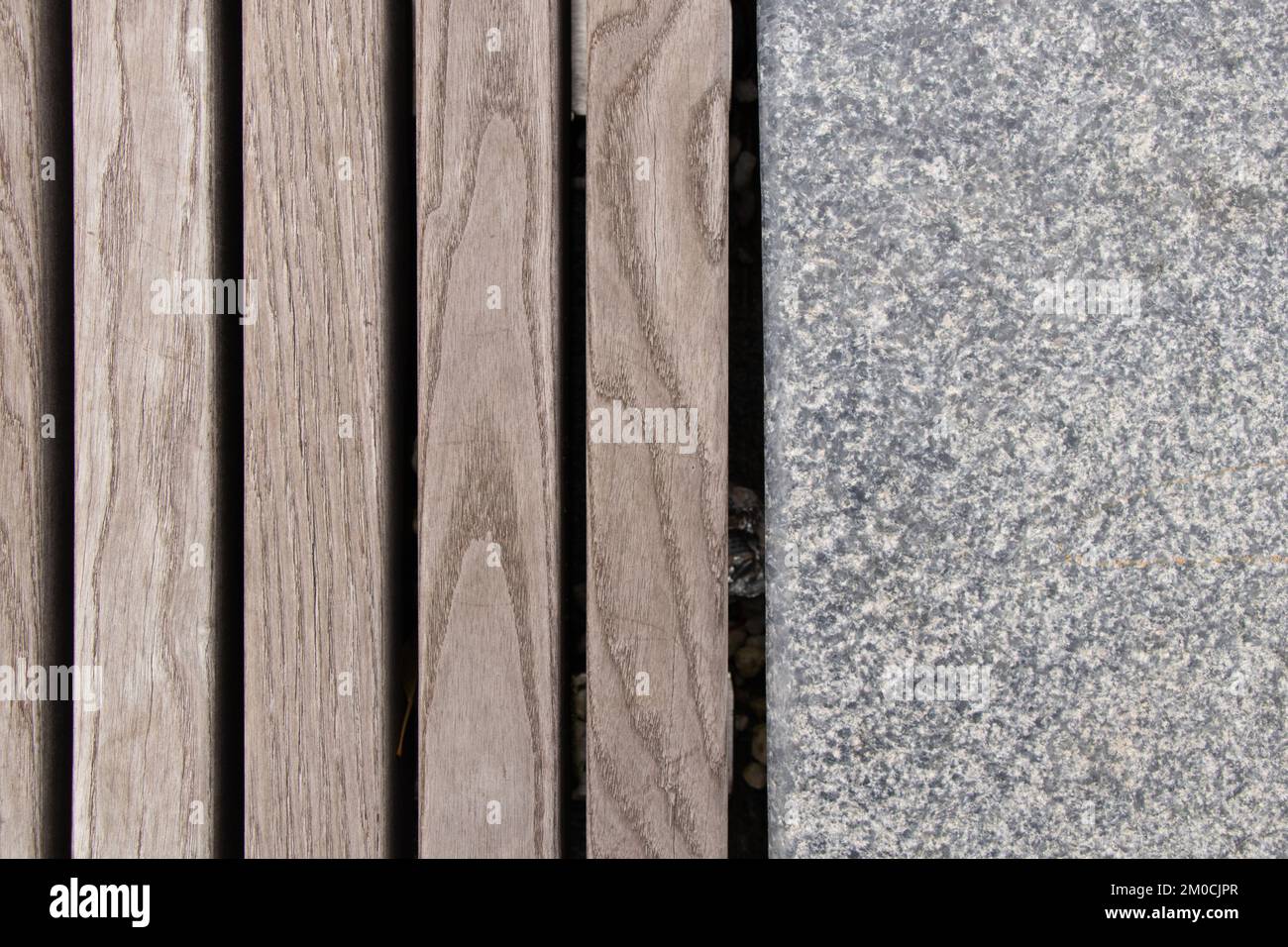 Wooden boards and concrete stone as background, outdoor bench as background Stock Photo