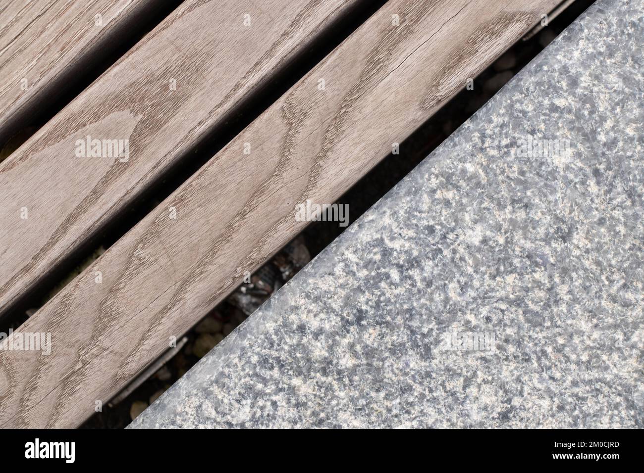 Wooden boards and concrete stone as background, outdoor bench as background Stock Photo