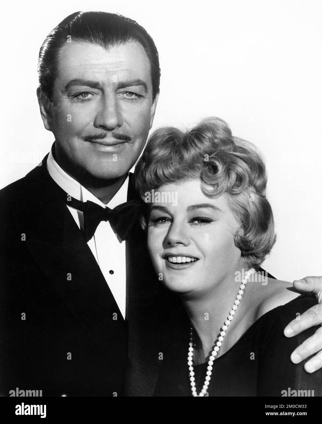 ROBERT TAYLOR and SHELLEY WINTERS as New York Bordello Madam Polly Adler publicity portrait in A HOUSE IS NOT A HOME 1964 director RUSSELL ROUSE from book by Polly Adler costume design Edith Head presenter Joseph E. Levine Embassy Pictures / Paramount Pictures Stock Photo