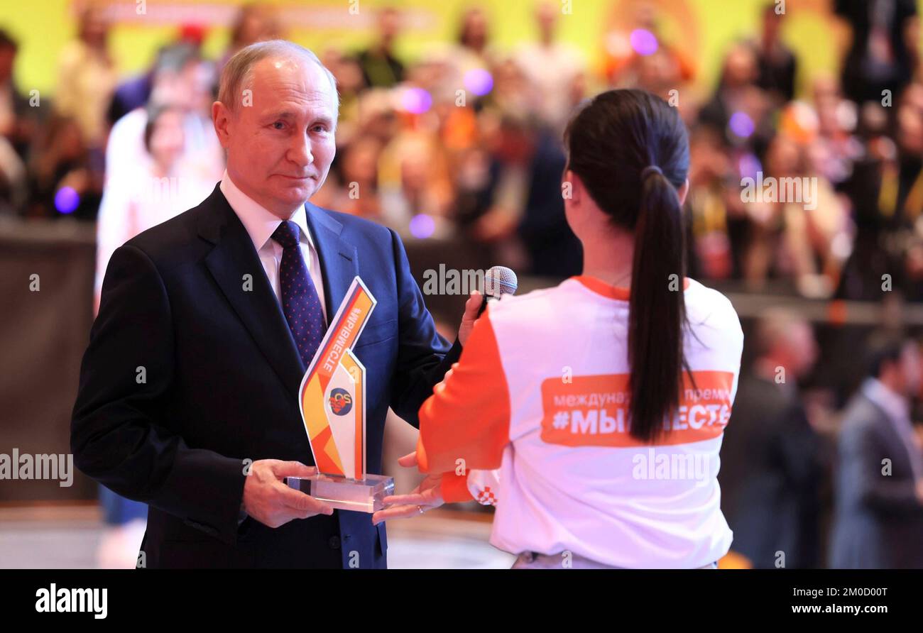 Moscow, Russia. 05th Dec, 2022. Russian President Vladimir Putin prepares to announce the Volunteer of the Year award during the #WeAreTogether volunteer forum at the Manezh Central Exhibition Hall, December 5, 2022 in Moscow, Russia. Credit: Mikhail Metzel/Kremlin Pool/Alamy Live News Stock Photo