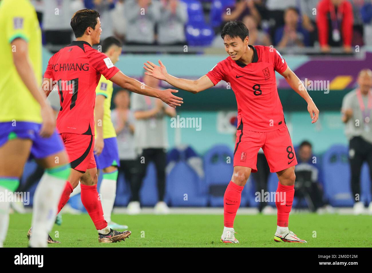 Qatar, 05/12/2022, Doha, Qatar. 05th Dec, 2022. Seung-ho Paik of Korea Republic scores and celebrates with Heechan Hwang of Korea Republic during the FIFA World Cup Qatar 2022 match between Brazil and South Korea at Stadium 974, Doha, Qatar on 5 December 2022. Photo by Peter Dovgan. Editorial use only, license required for commercial use. No use in betting, games or a single club/league/player publications. Credit: UK Sports Pics Ltd/Alamy Live News Stock Photo
