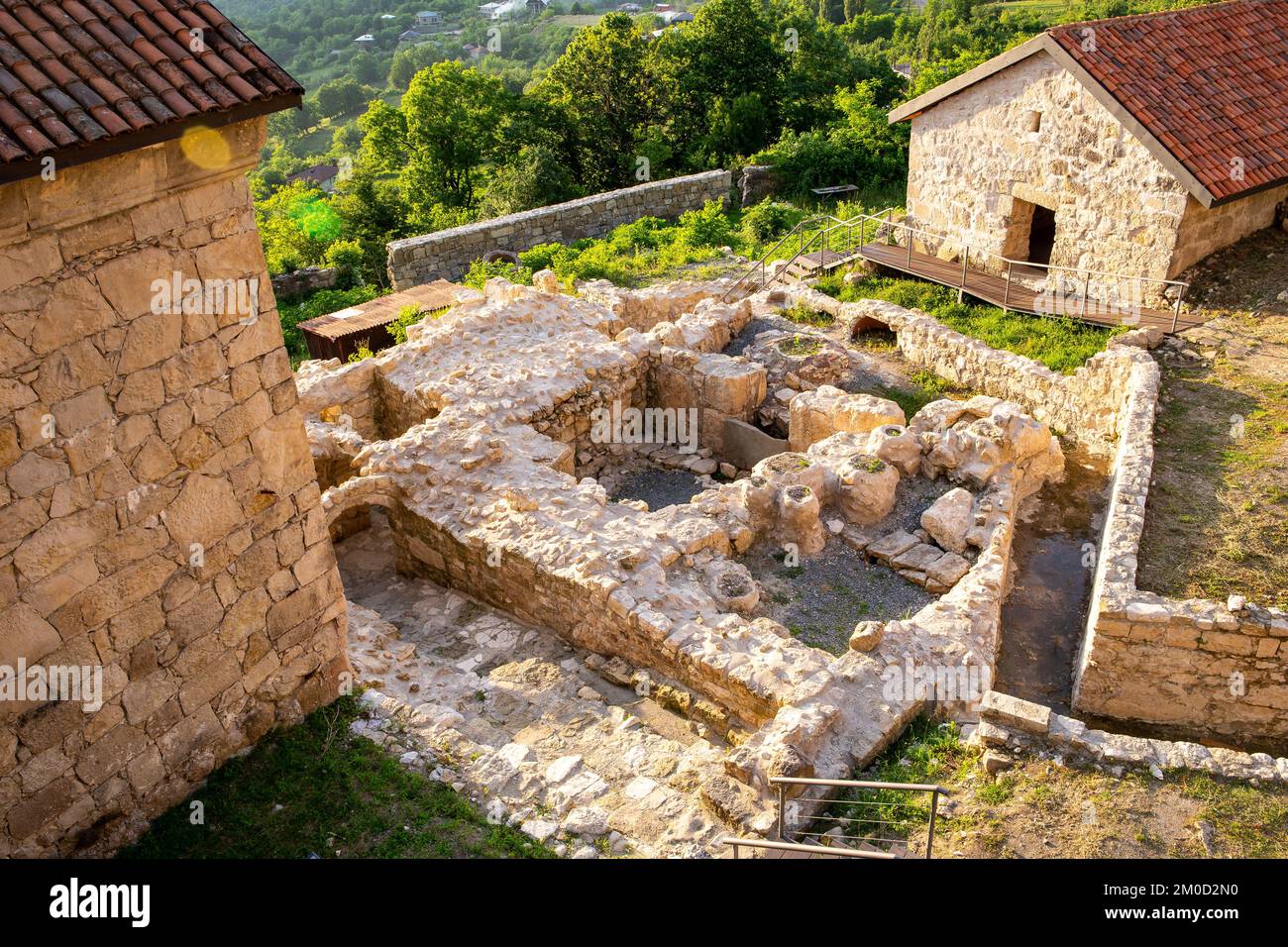 Gelati Monastery, medieval archaeological excavations next to Academy building, foundation walls, cellars with stone water jars, Kutaisi, Georgia. Stock Photo
