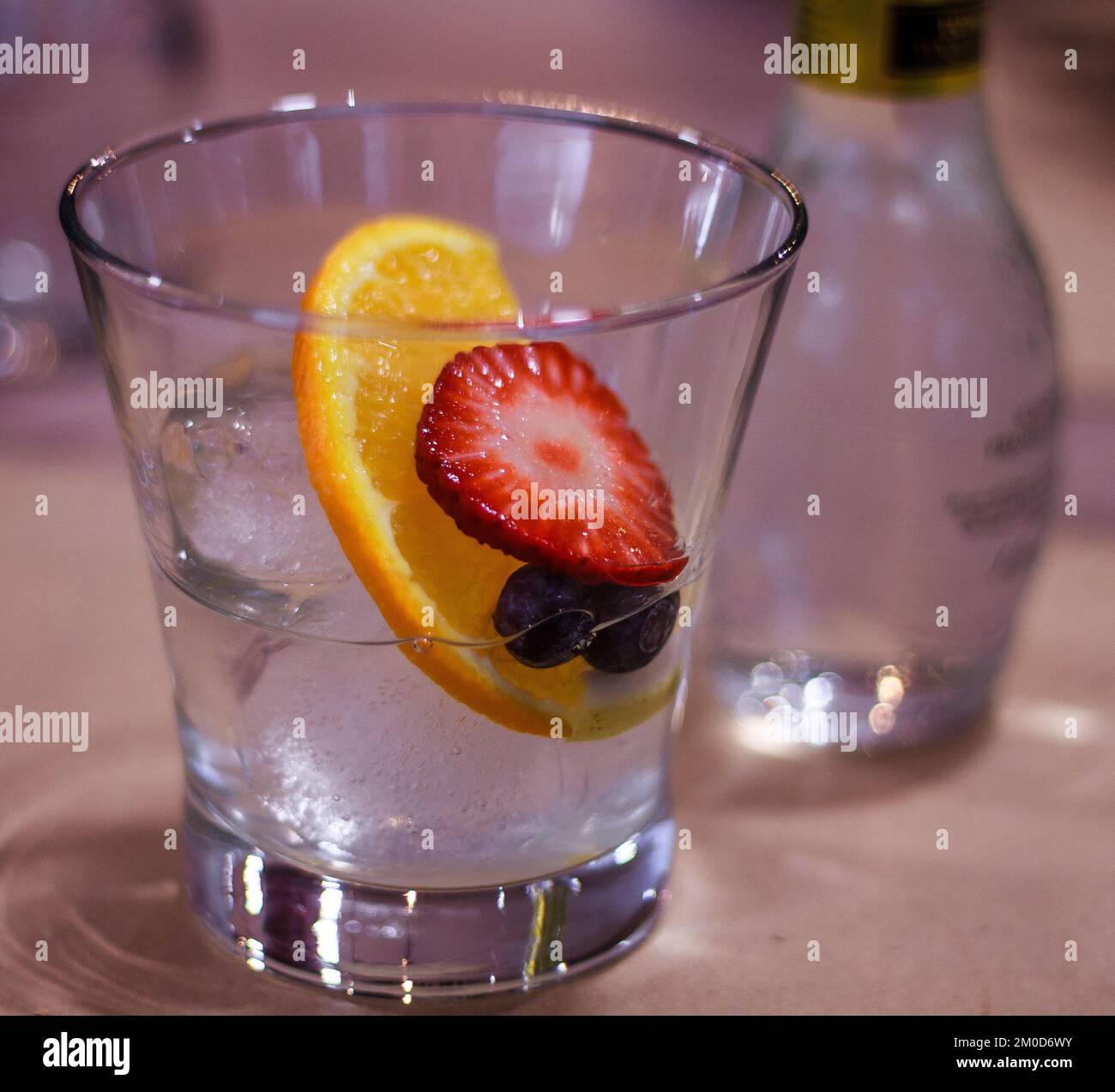 Half Gin Tonic server with dessert Stock Photo Alamy