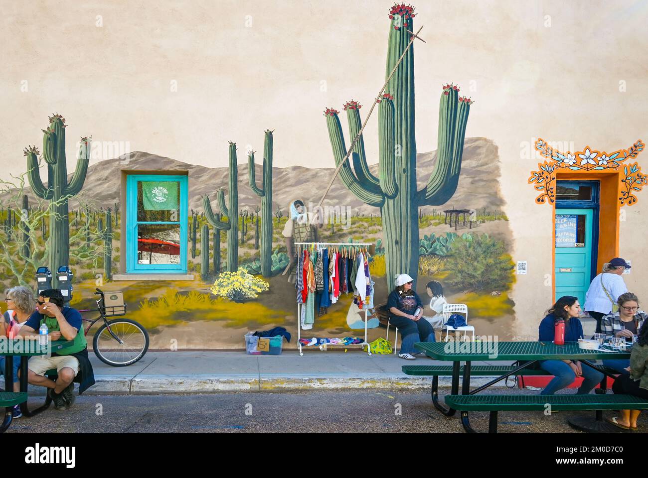 Lifelike mural comes alive with tuna harvesting of the saguaros by