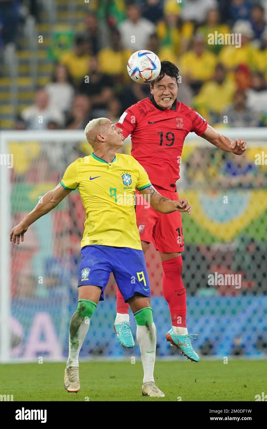 DOHA, QATAR - DECEMBER 5: Player of Brazil Richarlison fights for the ball with player of South Korea Kim Young-gwon during the FIFA World Cup Qatar 2022 Round of 16 match between Brazil and South Korea at Stadium 974 on December 5, 2022 in Doha, Qatar. (Photo by Florencia Tan Jun/PxImages) Stock Photo