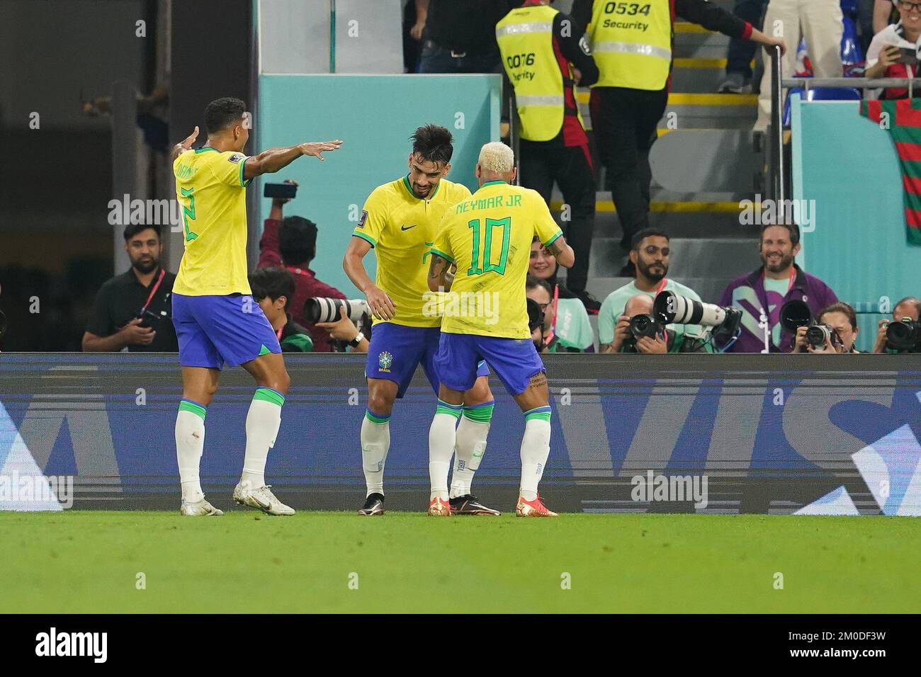 DOHA, QATAR - DECEMBER 5: Player of Brazil Lucas Paquetá celebrates with his teammates Danilo and Neymar after scoring a goal during the FIFA World Cup Qatar 2022 Round of 16 match between Brazil and South Korea at Stadium 974 on December 5, 2022 in Doha, Qatar. (Photo by Florencia Tan Jun/PxImages) Stock Photo