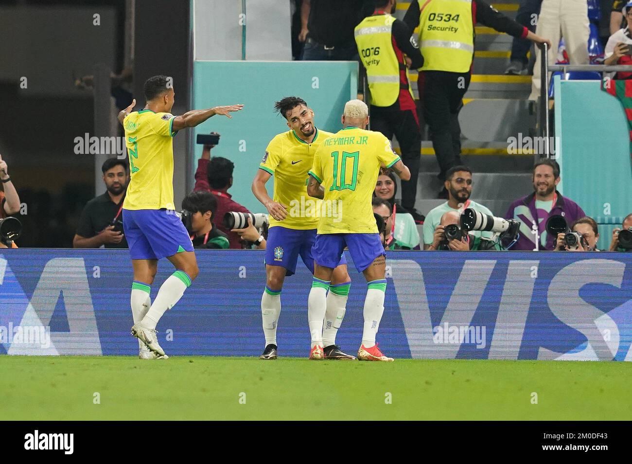 DOHA, QATAR - DECEMBER 5: Player of Brazil Lucas Paquetá celebrates with his teammates Danilo and Neymar after scoring a goal during the FIFA World Cup Qatar 2022 Round of 16 match between Brazil and South Korea at Stadium 974 on December 5, 2022 in Doha, Qatar. (Photo by Florencia Tan Jun/PxImages) Stock Photo