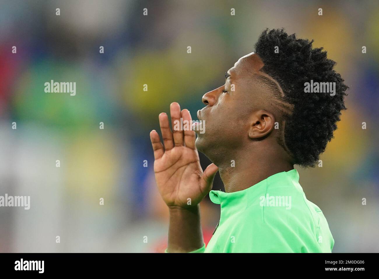 DOHA, QATAR - DECEMBER 5: Player of Brazil Vinícius Júnior prays before the FIFA World Cup Qatar 2022 Round of 16 match between Brazil and South Korea at Stadium 974 on December 5, 2022 in Doha, Qatar. (Photo by Florencia Tan Jun/PxImages) Stock Photo