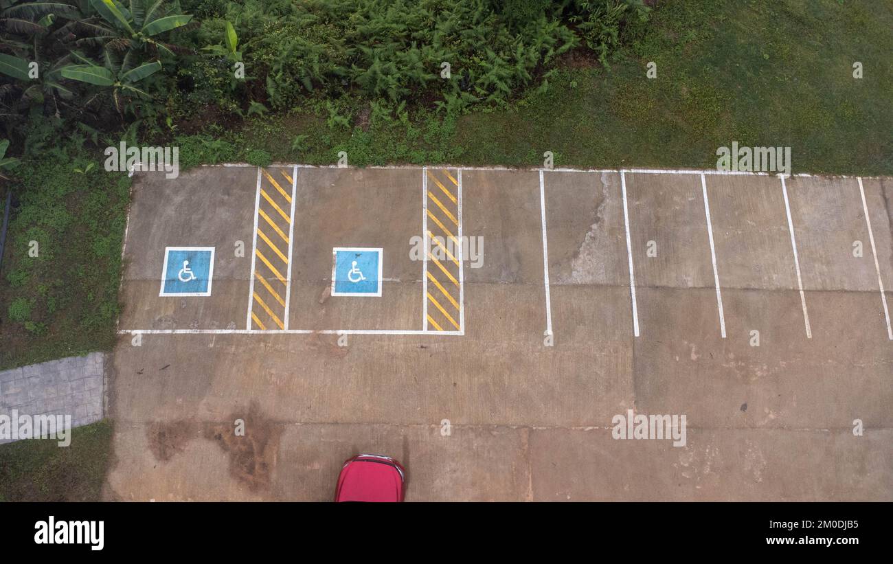 Aerial view of handicapped parking spaces in tourist destinations in Thailand. Parking with a special place for the disabled. Stock Photo