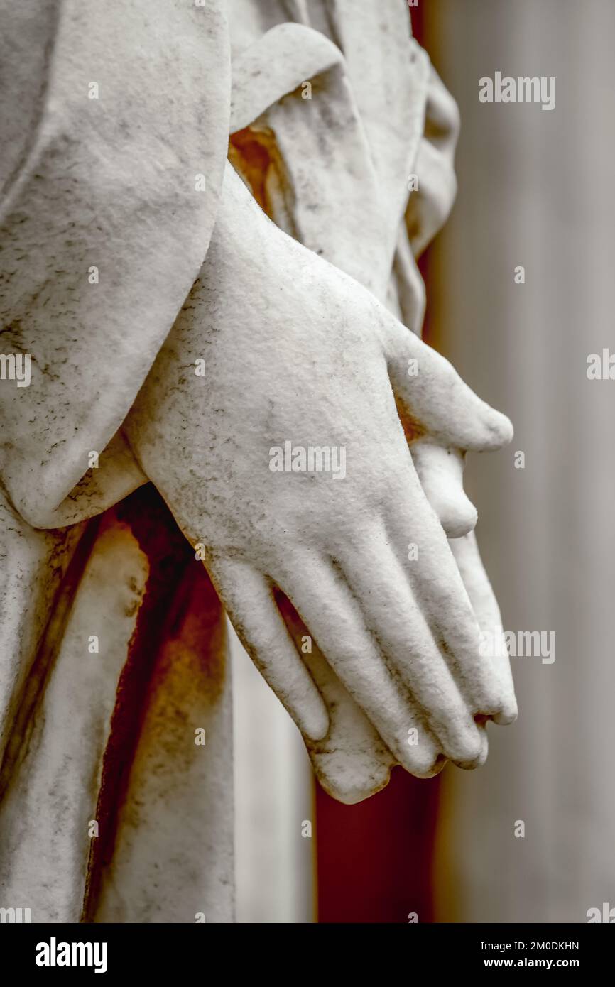 Faithfull Virgin Mary with praying hands and blessing, looking at the sky Stock Photo