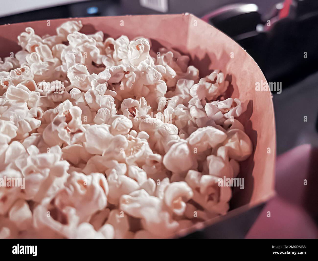 Cinema and entertainment, popcorn box in the movie theatre for tv show streaming service and film industry production branding Stock Photo