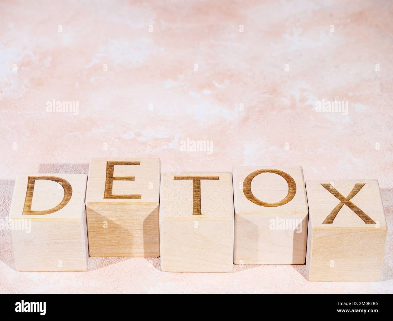 Wooden cubes with the word DETOX as a cleanse concept Stock Photo