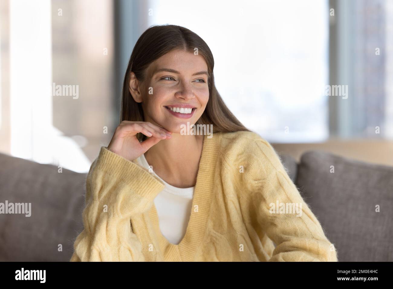 Joyful pretty young woman indoor candid portrait Stock Photo