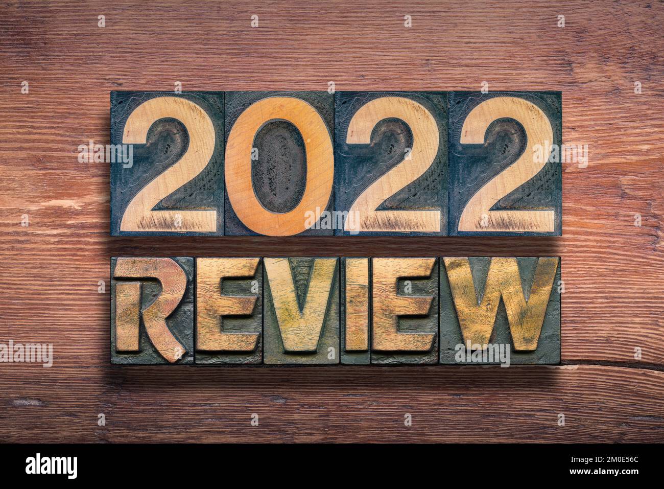 review 2022 phrase combined from vintage letterpress on wooden surface Stock Photo