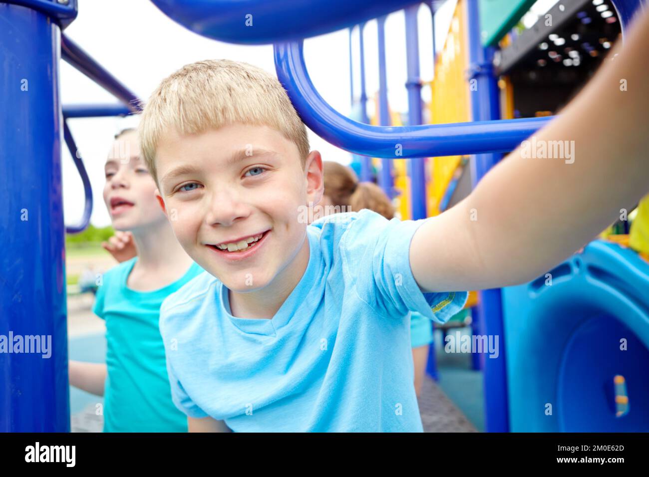 The playgrounds his favourite place. A multiethnic group of happy