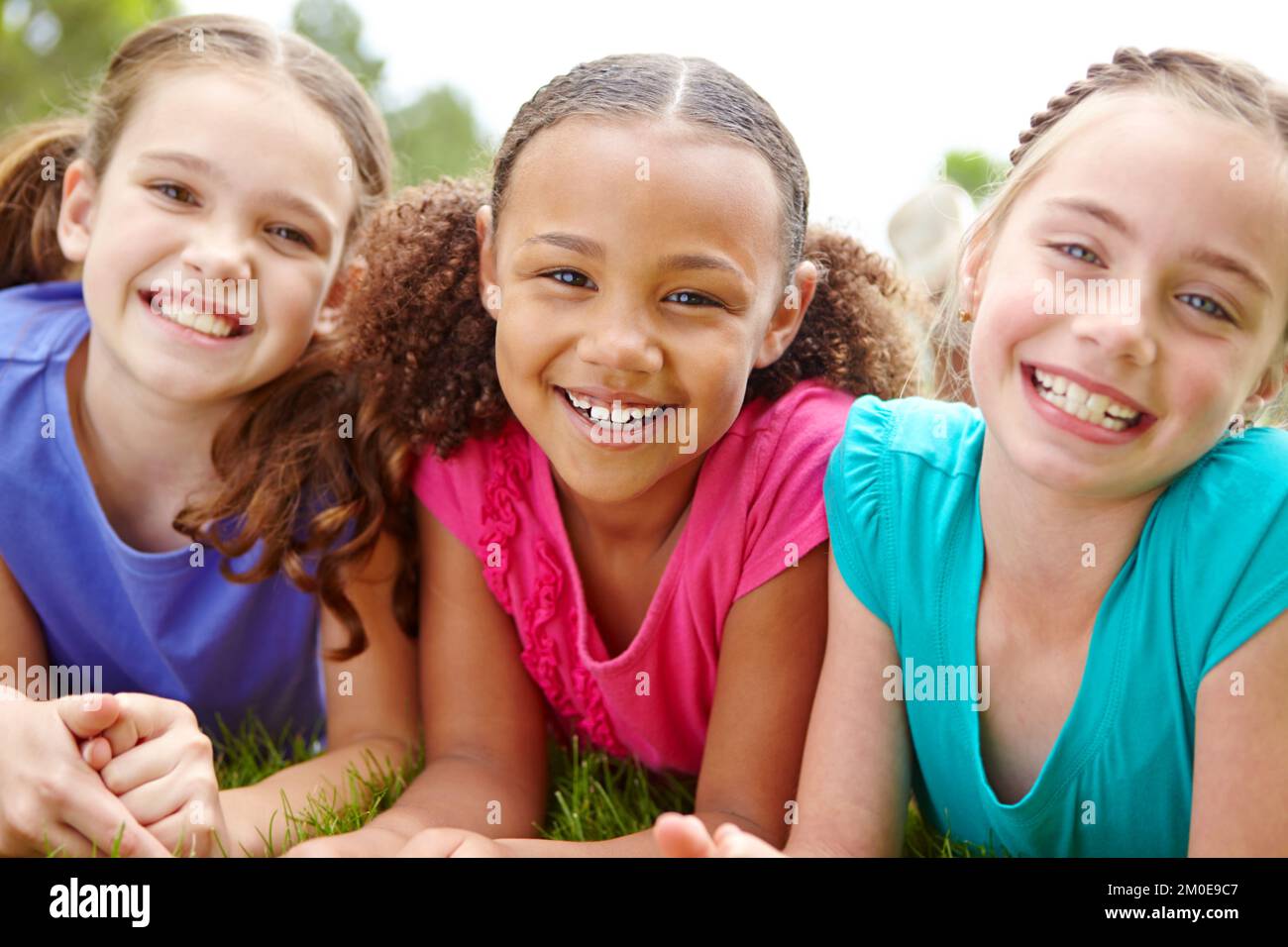 Young multi ethnic kids together hi-res stock photography and images ...