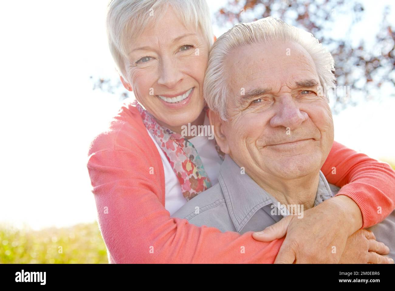Cherishing every moment together. A mature woman embracing her husband. Stock Photo