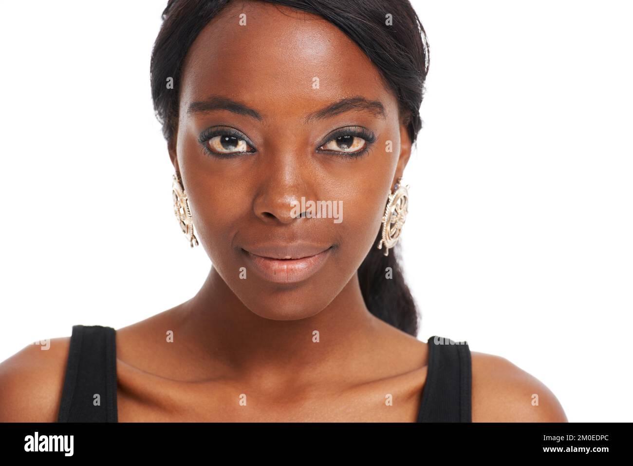 Natural beauty in focus. Young African woman isolated on white - head and shoulders portrait. Stock Photo