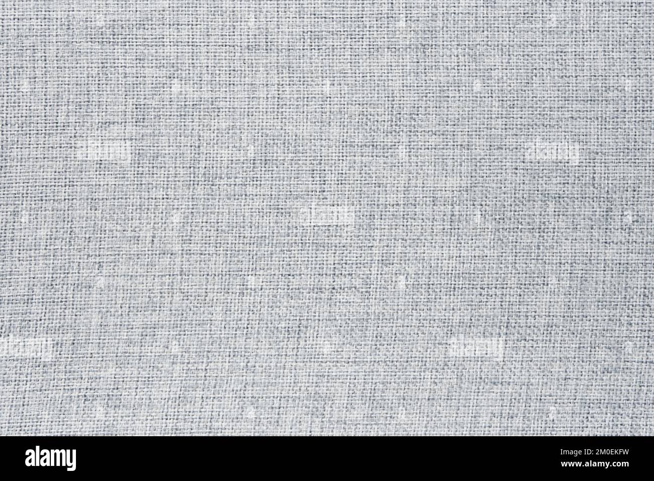 The texture of the light gray furniture fabric. Material for the